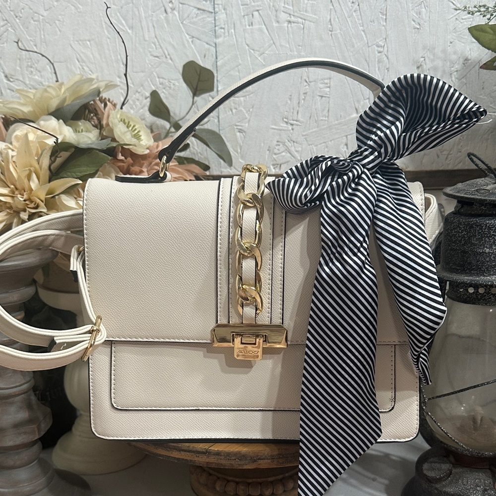 Aldo Cream Crossbody Bag with Gold Chain and Black Bow